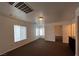 Upstairs loft features large window, recessed lighting, and neutral carpet at 8218 Golden Flowers St, Las Vegas, NV 89139