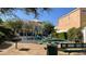 Community playground featuring a slide, picnic tables, and barbeque for outdoor fun at 8218 Golden Flowers St, Las Vegas, NV 89139
