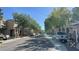 Street view in residential area featuring tree-lined streets and well-maintained homes at 8218 Golden Flowers St, Las Vegas, NV 89139