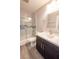 Bathroom showcasing a white vanity with a dark wood cabinet and a shower/tub combo with stylish tiles at 8600 W Charleston Blvd # 2068, Las Vegas, NV 89117
