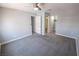 Light-filled bedroom features carpeted floors, ceiling fan, and access to an en-suite at 8600 W Charleston Blvd # 2068, Las Vegas, NV 89117