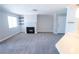 Spacious living room with black fireplace, shelving, and natural light from a window at 8600 W Charleston Blvd # 2068, Las Vegas, NV 89117