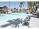 A stunning pool featuring lounge chairs and lush palm trees at 8600 W Charleston Blvd # 2068, Las Vegas, NV 89117