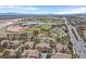 High view with an overview of community amenities and nearby sports fields surrounded by arid terrain at 8737 Red Brook Dr # 201, Las Vegas, NV 89128