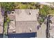 Overhead of a tile roof, showcasing a home with mature trees, landscaping, and a private driveway at 8737 Red Brook Dr # 201, Las Vegas, NV 89128