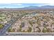 Expansive aerial view of a well-maintained residential community with lush landscaping and mountain views at 8737 Red Brook Dr # 201, Las Vegas, NV 89128
