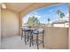 Cozy balcony with seating area and a scenic view of trees and the neighborhood at 8737 Red Brook Dr # 201, Las Vegas, NV 89128