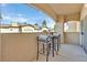 A tranquil balcony features a bistro set with comfortable cushions and neighborhood views at 8737 Red Brook Dr # 201, Las Vegas, NV 89128