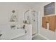 Bright bathroom features a shower, tub with decorations, and framed wall decor at 8737 Red Brook Dr # 201, Las Vegas, NV 89128