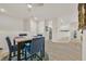 Dining area featuring a modern table set and open layout to the kitchen at 8737 Red Brook Dr # 201, Las Vegas, NV 89128