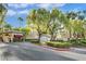 View of gated community entrance with manicured landscaping and clear signage for 'Redhills' at 8737 Red Brook Dr # 201, Las Vegas, NV 89128
