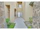 Welcoming front entrance featuring neutral tones, a secure door, and landscaped walkway at 8737 Red Brook Dr # 201, Las Vegas, NV 89128