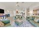 Bright living room with modern decor, stylish furniture, and seamless flow to the kitchen and dining area at 8737 Red Brook Dr # 201, Las Vegas, NV 89128