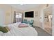 Bright main bedroom with plush carpeting and slider that opens to a small balcony at 8737 Red Brook Dr # 201, Las Vegas, NV 89128