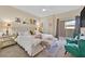 Serene primary bedroom featuring a plush bed, sitting area, and sliding glass doors at 8737 Red Brook Dr # 201, Las Vegas, NV 89128