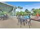 Inviting pool area with covered patio seating, perfect for relaxation and enjoying the outdoors at 8737 Red Brook Dr # 201, Las Vegas, NV 89128