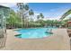 A refreshing swimming pool with inviting seating, a covered patio, and lush landscaping at 8737 Red Brook Dr # 201, Las Vegas, NV 89128