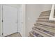 Bright foyer with a staircase featuring carpeted treads and access to upper floors at 8737 Red Brook Dr # 201, Las Vegas, NV 89128