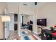 This bedroom offers mirrored closet doors, a desk, and a TV for entertainment and convenience at 8934 Libertyvale Dr, Las Vegas, NV 89123