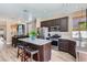 Modern kitchen featuring stainless steel appliances, ample counter space, a center island, and adjacent dining area at 8934 Libertyvale Dr, Las Vegas, NV 89123