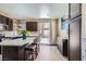 Spacious kitchen boasting a large center island with seating, stainless steel appliances, and ample cabinet space at 8934 Libertyvale Dr, Las Vegas, NV 89123