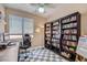 Inviting office space features checkered flooring, bookshelves, and desk area, perfect for a productive work environment at 8934 Libertyvale Dr, Las Vegas, NV 89123