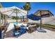 Outdoor patio area, with plenty of shade, and lounge seating next to the pool at 8934 Libertyvale Dr, Las Vegas, NV 89123