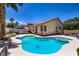 Sparkling pool with spa and mature landscaping creating a private backyard oasis at 8934 Libertyvale Dr, Las Vegas, NV 89123