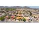 An aerial view of a residential area with neat rows of houses, streets, and distant mountains enhancing community appeal at 905 White Thunder St, Henderson, NV 89002