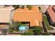Aerial view of a private backyard oasis with a refreshing pool, patio seating, and verdant landscaping, ideal for relaxation at 905 White Thunder St, Henderson, NV 89002