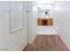 Hallway leads to a bathroom, showcasing tile flooring and a vanity with double sinks at 905 White Thunder St, Henderson, NV 89002