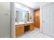 Bathroom with double sinks, vanity and shower with tile flooring at 905 White Thunder St, Henderson, NV 89002