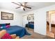 Comfortable bedroom with full length mirror closet doors across from entry door at 905 White Thunder St, Henderson, NV 89002