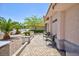 Exterior shot showing front patio seating and drought tolerant landscaping at 905 White Thunder St, Henderson, NV 89002