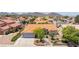 Charming single-story home with a tile roof, well-manicured landscaping, and a spacious driveway showcasing suburban living at 905 White Thunder St, Henderson, NV 89002