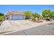 Lovely single-story home with a two-car garage, mature landscaping, and a spacious driveway at 905 White Thunder St, Henderson, NV 89002