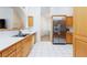 Spacious kitchen featuring stainless steel appliances and white tile floors at 905 White Thunder St, Henderson, NV 89002