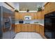 Well-lit kitchen with stainless steel appliances and plenty of cabinet space at 905 White Thunder St, Henderson, NV 89002