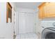 Bright laundry area featuring ample storage and washer/dryer at 905 White Thunder St, Henderson, NV 89002