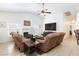 Cozy living room featuring a fireplace, ceiling fan, and comfortable seating at 905 White Thunder St, Henderson, NV 89002