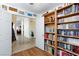 Bright office with built-in shelves and stylish decor, seamlessly connected to the rest of the home at 905 White Thunder St, Henderson, NV 89002