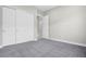 Neutral bedroom with carpet and a closet with sliding doors at 9475 W Rosada Way, Las Vegas, NV 89149