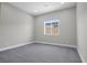 Neutral bedroom with carpet, window, and simple design at 9475 W Rosada Way, Las Vegas, NV 89149