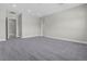 Large, neutral bedroom with carpeted floor and open doorway at 9475 W Rosada Way, Las Vegas, NV 89149