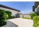 Private courtyard with a tile floor and mature landscaping creating a serene space at 9475 W Rosada Way, Las Vegas, NV 89149