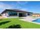 A beautifully landscaped yard with a tiled patio and a sparkling pool, perfect for outdoor living at 9475 W Rosada Way, Las Vegas, NV 89149