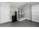 Garage featuring epoxy flooring, dual water heaters, water filter, and door to the house at 9475 W Rosada Way, Las Vegas, NV 89149