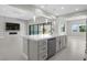 Gourmet kitchen featuring modern appliances, a spacious island, and easy access to the Gathering room at 9475 W Rosada Way, Las Vegas, NV 89149