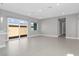 Open-concept living area with sliding glass doors leading to the backyard at 9475 W Rosada Way, Las Vegas, NV 89149
