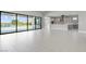 Bright open living space with a view of the outdoor pool and access to the gourmet kitchen at 9475 W Rosada Way, Las Vegas, NV 89149